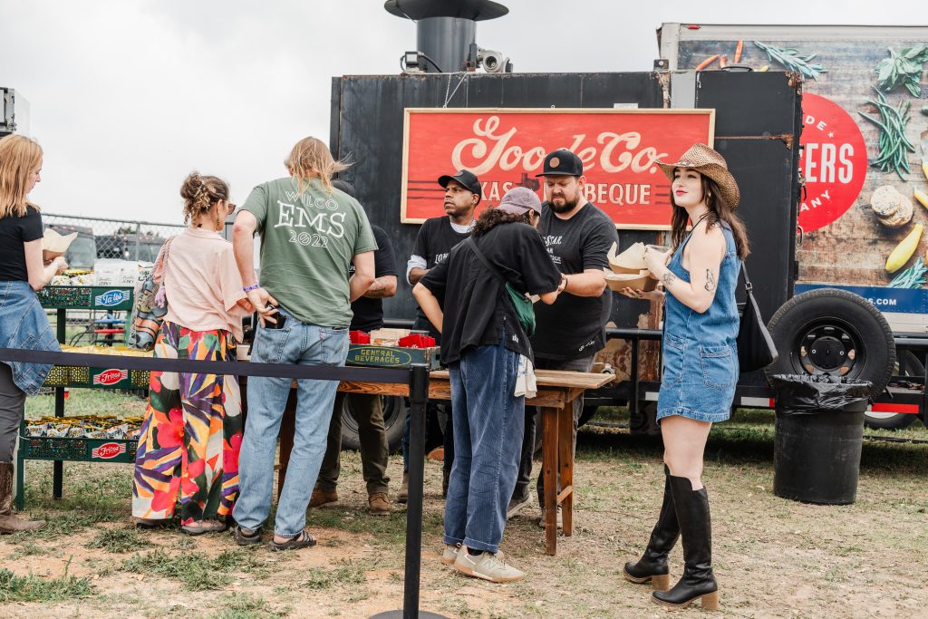 Group of People Getting BBQ from Goode Co. Catering